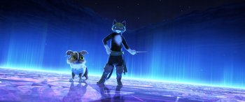 Movie still from “Puss in Boots: The Last Wish” (2022), directed by Januel Mercado – A person and a dog standing next to each other; Wide shot, Low angle