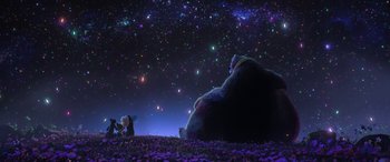 Movie still from “Puss in Boots: The Last Wish” (2022), directed by Januel Mercado – A large teddy bear sitting next to a small teddy bear; Extreme Wide shot, Low angle