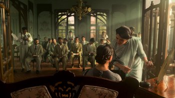 A group of people sitting in front of a woman