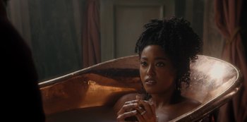 Movie still from “Queen Charlotte: A Bridgerton Story” (2023), directed by Tom Verica – A woman sitting in a bath tub in a room; Close Up shot, Over the shoulder angle