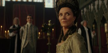 Movie still from “Queen Charlotte: A Bridgerton Story” (2023), directed by Tom Verica – A person wearing a dress and a crown; Close Up shot, Over the shoulder angle