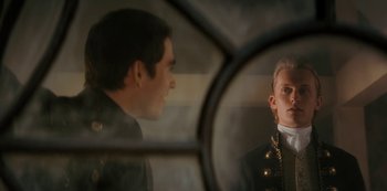 Movie still from “Queen Charlotte: A Bridgerton Story” (2023), directed by Tom Verica – A man looking at himself in a mirror; Close Up shot, Over the shoulder angle