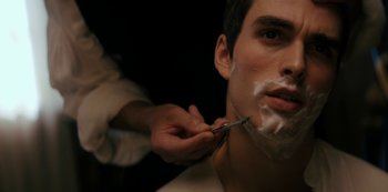 Movie still from “Queen Charlotte: A Bridgerton Story” (2023), directed by Tom Verica – A man getting his face shaven with a pair of shears; Close Up shot, Over the shoulder angle