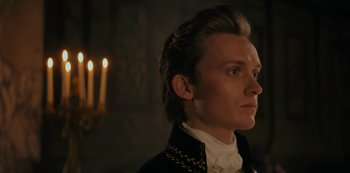 Movie still from “Queen Charlotte: A Bridgerton Story” (2023), directed by Tom Verica – A person wearing a jacket; Close Up shot, Low angle