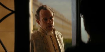Movie still from “Queen Charlotte: A Bridgerton Story” (2023), directed by Tom Verica – A person standing near a window; Close Up shot, Over the shoulder angle