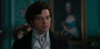 Movie still from “Queen Charlotte: A Bridgerton Story” (2023), directed by Tom Verica – A person wearing a suit and tie; Close Up shot, Over the shoulder angle