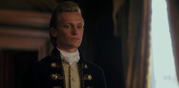 Movie still from “Queen Charlotte: A Bridgerton Story” (2023), directed by Tom Verica – A man in a suit and a white shirt; Close Up shot, Low angle