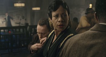 Movie still from “Ray” (2004), directed by Taylor Hackford – An older woman is looking at the camera while a younger man looks on; Close Up shot, Over the shoulder angle