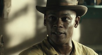 Movie still from “Ray” (2004), directed by Taylor Hackford – A person wearing a hat; Close Up shot, Low angle