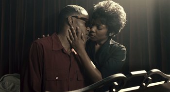 Movie still from “Ray” (2004), directed by Taylor Hackford – A man and a woman are kissing in the dark; Close Up shot, Low angle