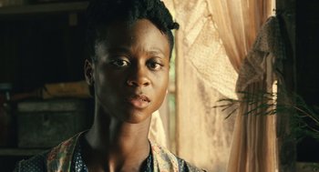 Movie still from “Ray” (2004), directed by Taylor Hackford – A person wearing a dress; Close Up shot, Over the shoulder angle