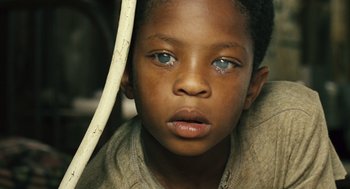 Movie still from “Ray” (2004), directed by Taylor Hackford – A child with blue eyes; Close Up shot, High angle