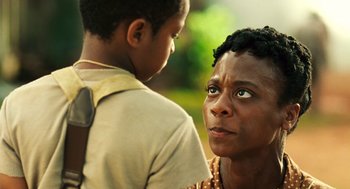Movie still from “Ray” (2004), directed by Taylor Hackford – A woman and a boy looking at one another; Close Up shot, Over the shoulder angle