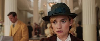 Movie still from “Rebecca” (2020), directed by Ben Wheatley – A person wearing a hat; Close Up shot, Over the shoulder angle