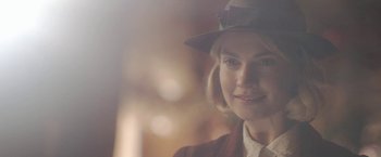 Movie still from “Rebecca” (2020), directed by Ben Wheatley – A person wearing a hat; Close Up shot, Over the shoulder angle