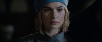 Movie still from “Rebecca” (2020), directed by Ben Wheatley – A person wearing a hat; Close Up shot, Over the shoulder angle