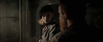 Movie still from “Rebecca” (2020), directed by Ben Wheatley – A man and a woman are standing next to each other; Close Up shot, Over the shoulder angle