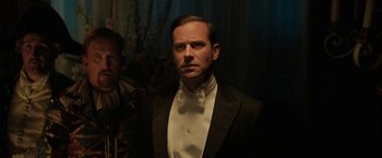 Movie still from “Rebecca” (2020), directed by Ben Wheatley – A man in a tuxedo standing in front of a mirror; Close Up shot, Over the shoulder angle