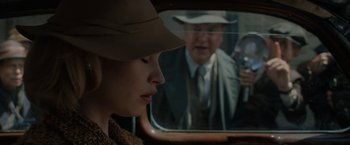 Movie still from “Rebecca” (2020), directed by Ben Wheatley – A man and a woman are looking in a mirror; Close Up shot, Over the shoulder angle