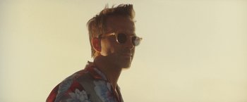 Movie still from “Red Notice” (2021), directed by Rawson Marshall Thurber – A person with sunglasses on; Close Up shot, Low angle