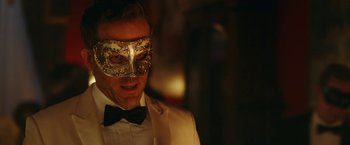 Movie still from “Red Notice” (2021), directed by Rawson Marshall Thurber – A person wearing a mask; Close Up shot, Over the shoulder angle