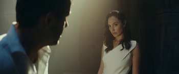 Movie still from “Red Notice” (2021), directed by Rawson Marshall Thurber – A woman standing in front of a mirror looking at a man; Close Up shot, Over the shoulder angle