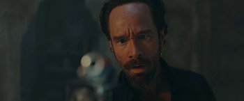 Movie still from “Red Notice” (2021), directed by Rawson Marshall Thurber – A person with a gun; Close Up shot, Low angle