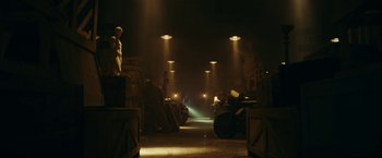 Movie still from “Red Notice” (2021), directed by Rawson Marshall Thurber – A room filled with lots of lights in the middle of a room; Wide shot, Low angle