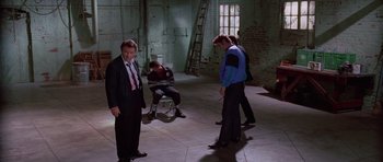 Movie still from “Reservoir Dogs” (1992), directed by Quentin Tarantino – A group of men standing in a room; Wide shot, High angle