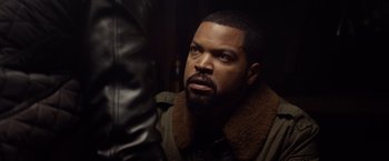 Movie still from “Ride Along” (2014), directed by Tim Story – A man with a beard is looking at the camera; Close Up shot, Over the shoulder angle