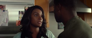 Movie still from “Ride Along” (2014), directed by Tim Story – A woman and a man are looking at each other; Close Up shot, Over the shoulder angle