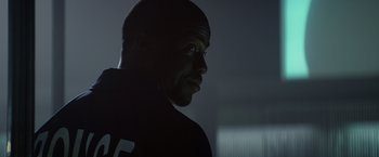 Movie still from “Ride Along” (2014), directed by Tim Story – A man's face in a dark room; Close Up shot, Low angle