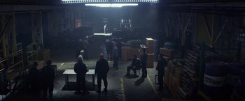 Movie still from “Ride Along” (2014), directed by Tim Story – A group of people standing in a parking lot at night; Extreme Wide shot, High angle