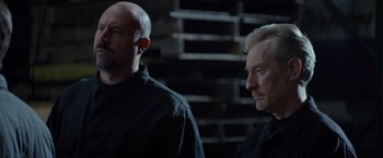 Movie still from “Ride Along” (2014), directed by Tim Story – A couple of men standing next to each other; Medium shot, Low angle