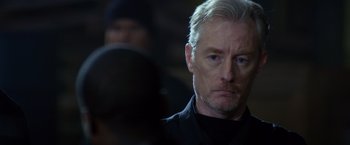 Movie still from “Ride Along” (2014), directed by Tim Story – A person wearing a black shirt; Close Up shot, Over the shoulder angle