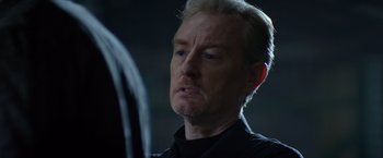 Movie still from “Ride Along” (2014), directed by Tim Story – A person wearing a black shirt; Close Up shot, Over the shoulder angle