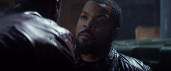 Movie still from “Ride Along” (2014), directed by Tim Story – A man in a leather jacket looking at another man in a leather jacket; Close Up shot, Over the shoulder angle
