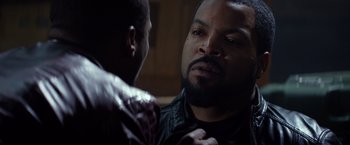 Movie still from “Ride Along” (2014), directed by Tim Story – A person looking at a mirror; Close Up shot, Over the shoulder angle