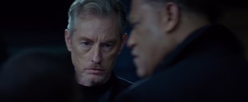 Movie still from “Ride Along” (2014), directed by Tim Story – A man and a man in a black shirt; Close Up shot, Over the shoulder angle