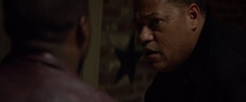Movie still from “Ride Along” (2014), directed by Tim Story – A man in a black shirt is talking to another man; Close Up shot, Over the shoulder angle