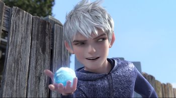 Movie still from “Rise of the Guardians” (2012), directed by Peter Ramsey – A young man holding a blue ball in his hand; Close Up shot, Over the shoulder angle