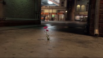 Movie still from “Rise of the Guardians” (2012), directed by Peter Ramsey – A single pink flower growing in the middle of a street; Extreme Wide shot, High angle