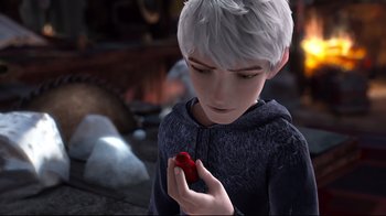 Movie still from “Rise of the Guardians” (2012), directed by Peter Ramsey – A boy holding a red object in his hands; Close Up shot, High angle