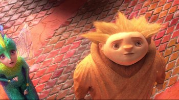 Movie still from “Rise of the Guardians” (2012), directed by Peter Ramsey – A cartoon character with a yellow hair wig; Close Up shot, High angle