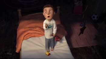 Movie still from “Rise of the Guardians” (2012), directed by Peter Ramsey – An animated boy standing on a bed holding a cell phone; Medium shot, Overhead angle