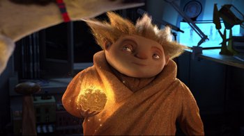 Movie still from “Rise of the Guardians” (2012), directed by Peter Ramsey – A person holding a ball in a room; Medium shot, Low angle