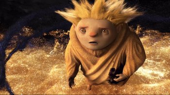 Movie still from “Rise of the Guardians” (2012), directed by Peter Ramsey – An animated creature with a blonde hair style holding a gun; Wide shot, High angle