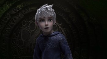 Movie still from “Rise of the Guardians” (2012), directed by Peter Ramsey – A young boy with white hair and blue eyes looking up; Close Up shot, Over the shoulder angle