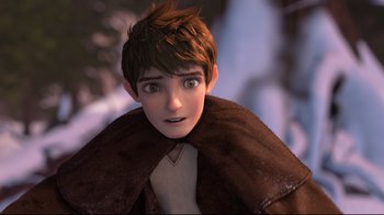 Movie still from “Rise of the Guardians” (2012), directed by Peter Ramsey – A young boy with a brown coat is looking at the camera; Close Up shot, High angle