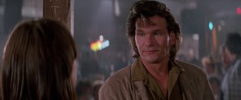 Movie still from “Road House” (1989), directed by Rowdy Herrington – A person with long hair; Close Up shot, Over the shoulder angle